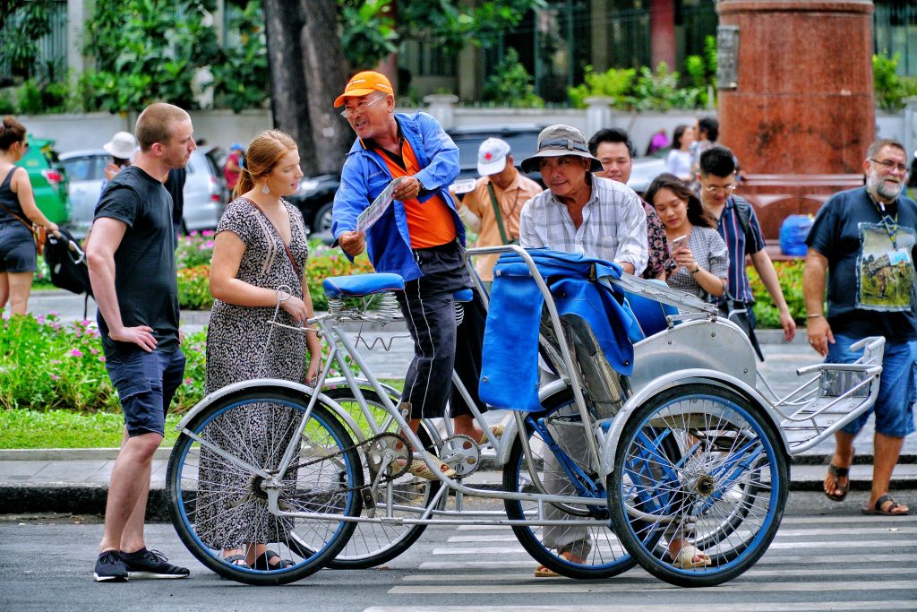 Local people and travelers interacting on a Vietnam street during the day